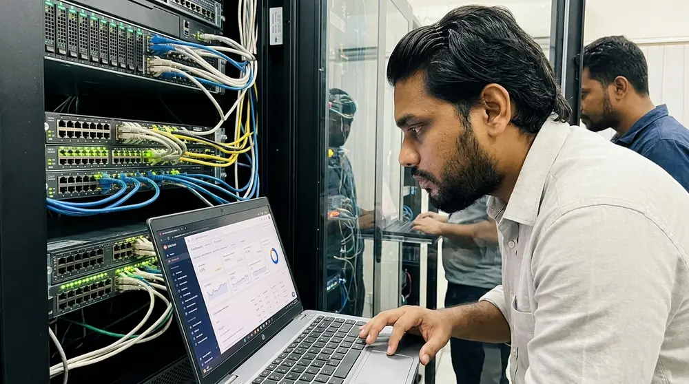 Technician monitoring server racks in a data center for technical SEO performance
